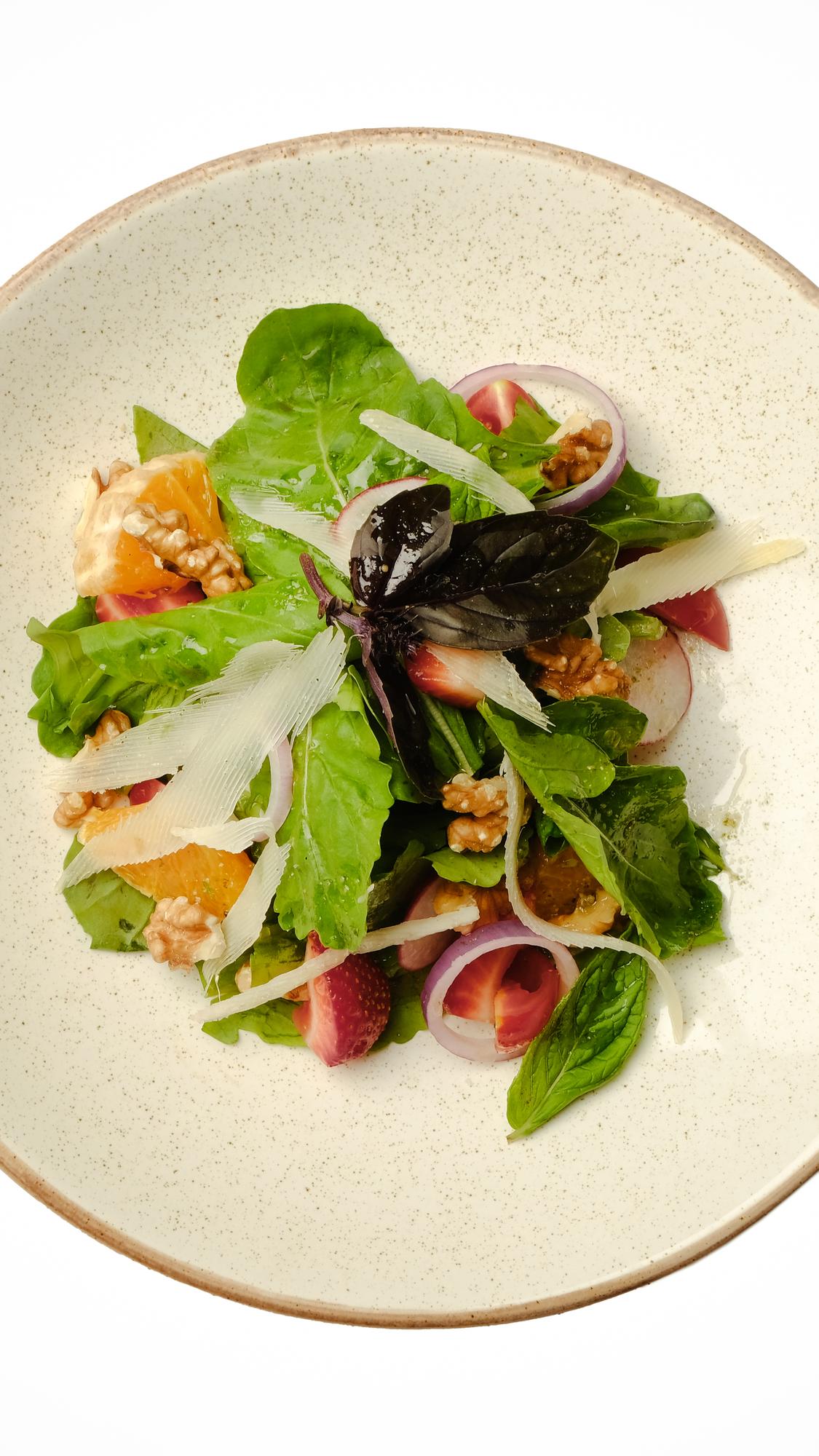 Plated seasonal salad on ceramic plate